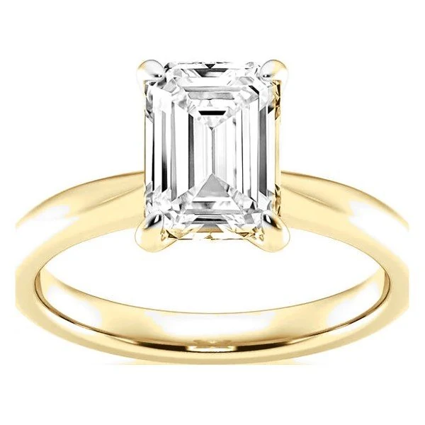 Classic Solitaire · Emerald in yellow gold